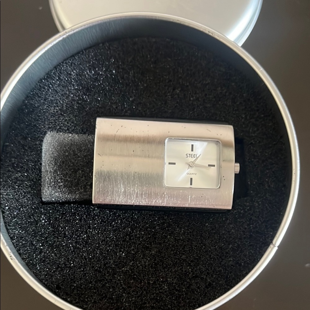 Watch by Steel. Great gift! Never used an in its original packaging.